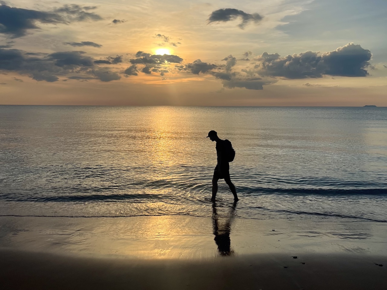 Walking along the beach at sunset in Koh Lanta, Thailand